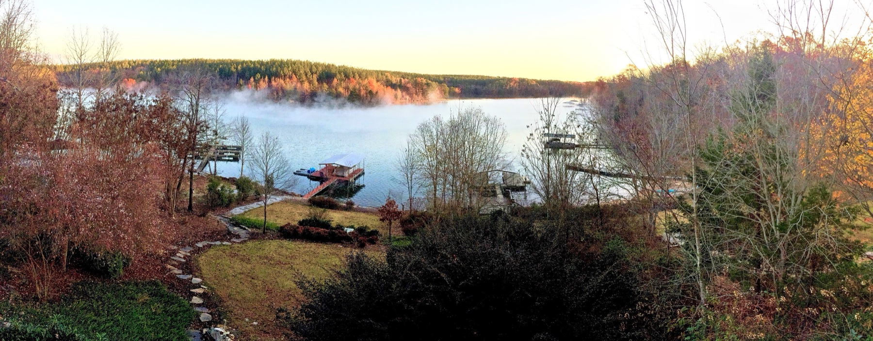 Morning mist on Lake Keowee, docks and fall colour